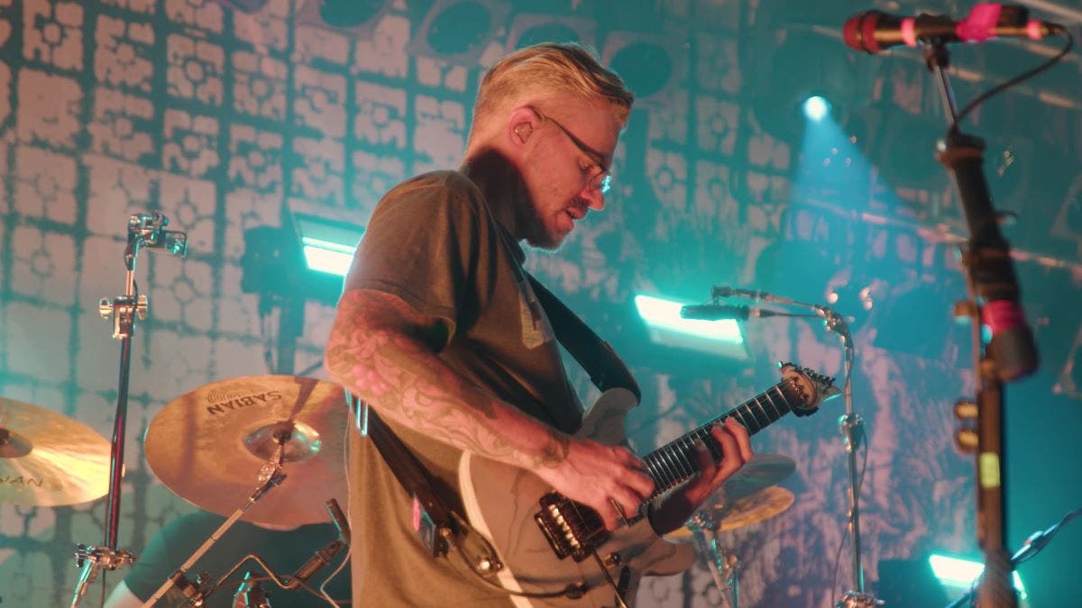 Paul Waggoner of Between the Buried and Me playing his signature Ibanez at an interview with American Musical Supply