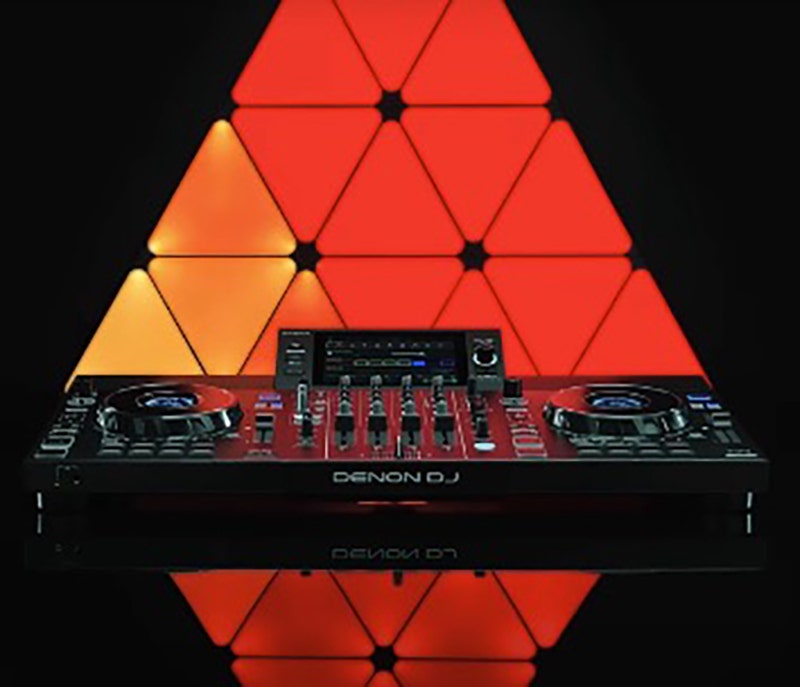 Denon DJ SC Live 4 standalone DJ controller featuring dual jog wheels, performance pads, and a central touchscreen display.