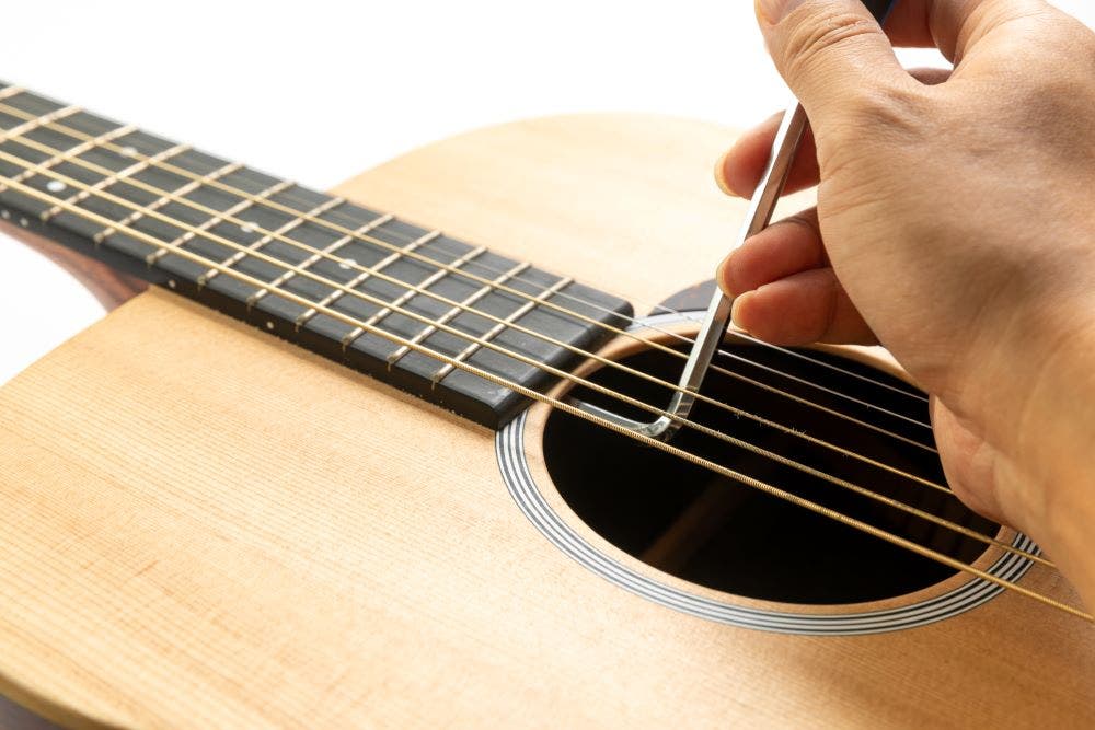 Truss rod adjustment on a guitar