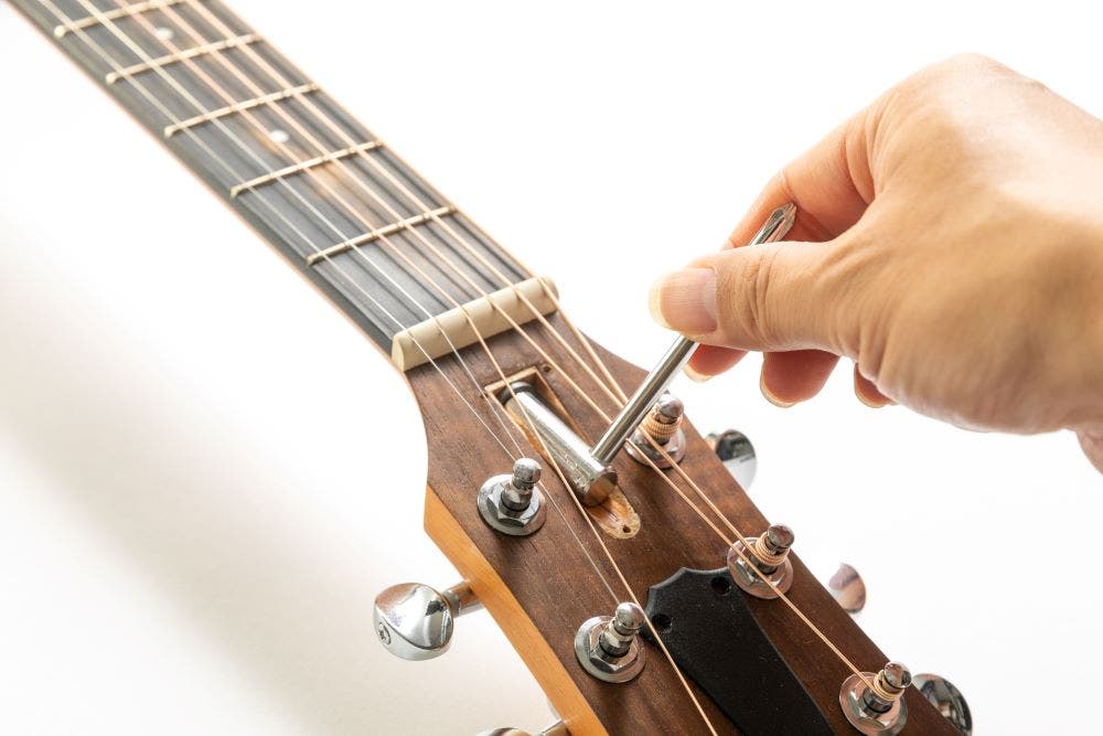 How to adjust an acoustic guitar truss rod
