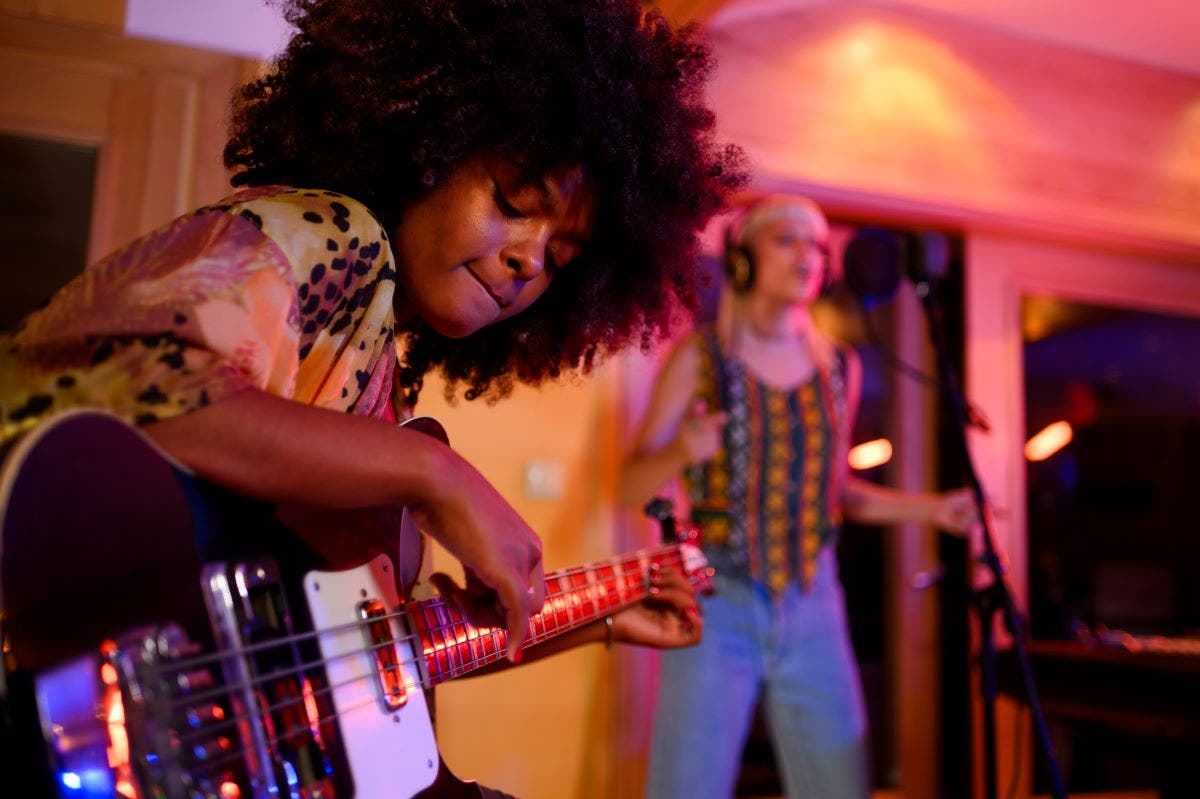 Musician playing on a well-adjusted truss rod guitar