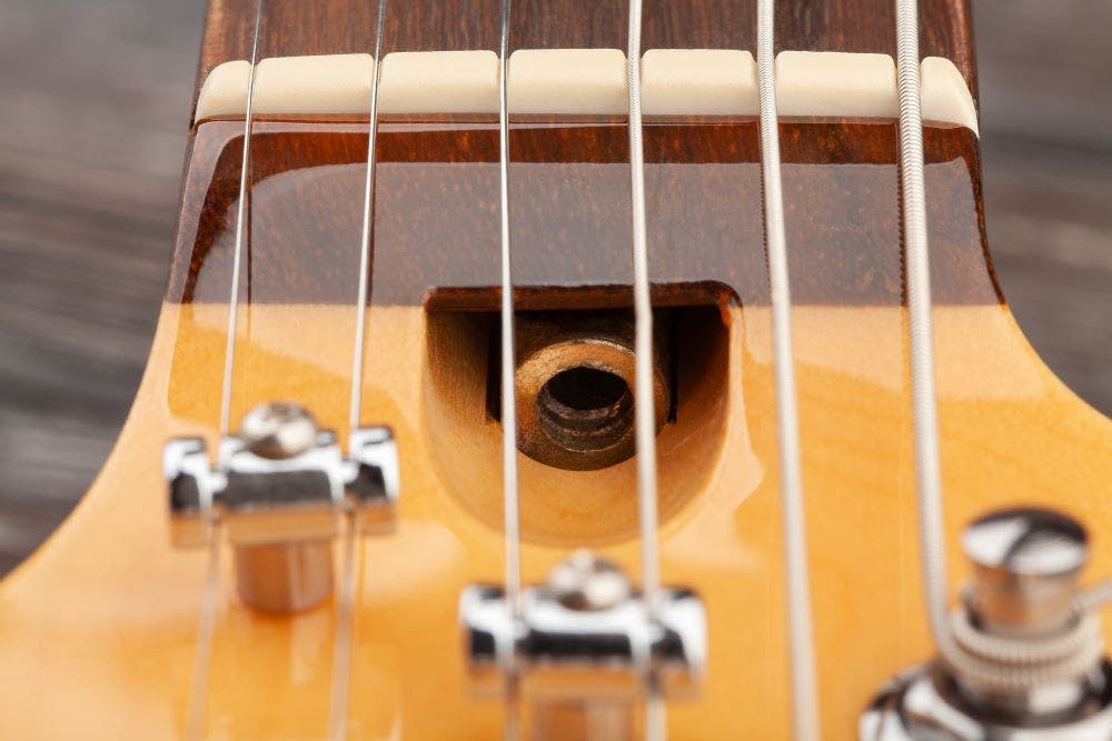 Closeup of guitar truss rod adjustment