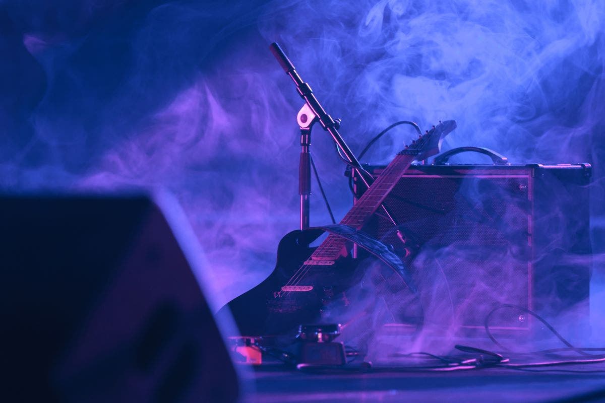 Guitar leaning against a combo amp