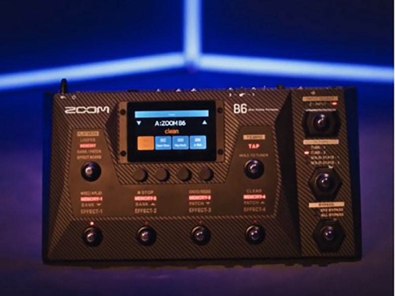 Zoom B6 bass multi-effects processor with LCD screen, looper, and multiple footswitches