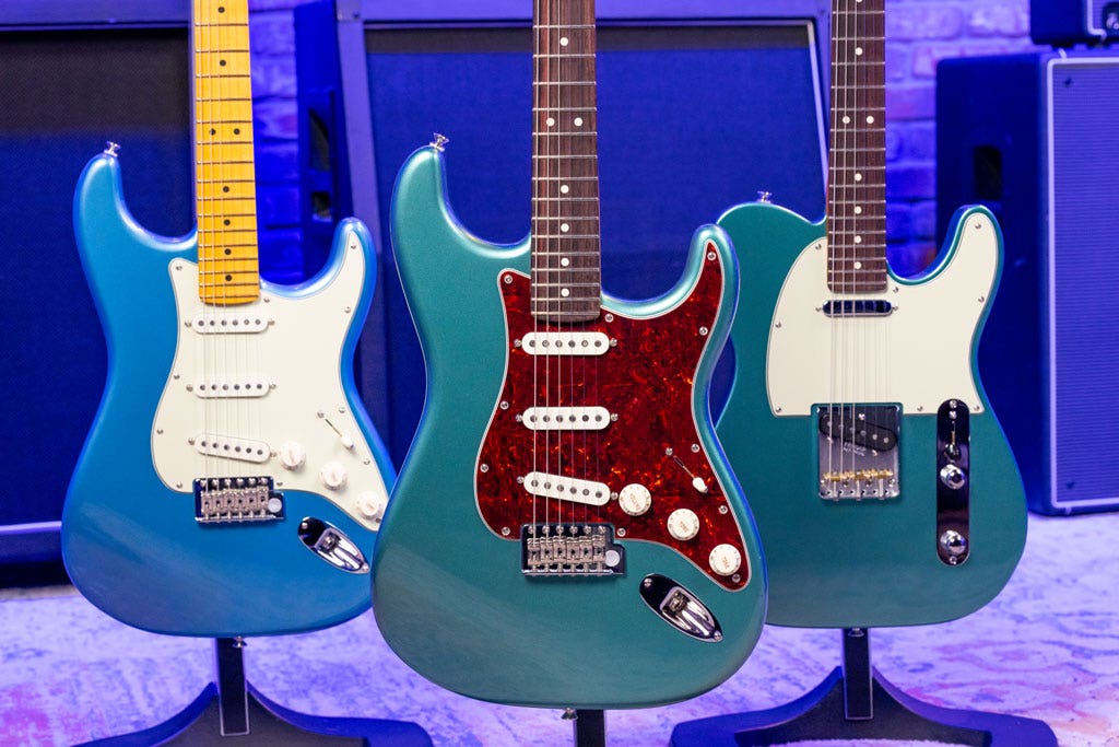 Photo of three solid body electric guitars in the AMS studio