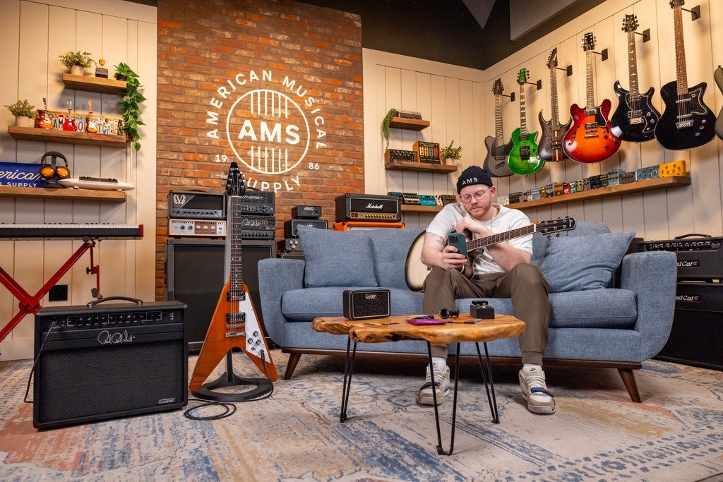 Guitarist holding an acoustic guitar