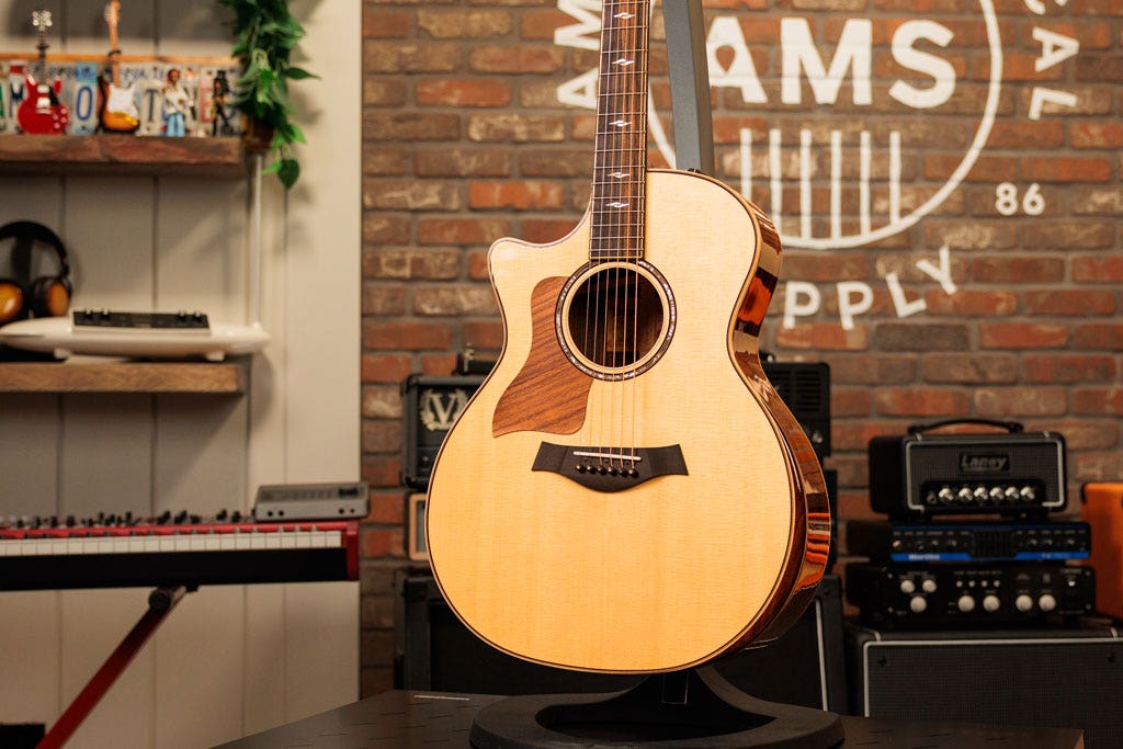 Photo of a left-handed acoustic guitar in the AMS studio