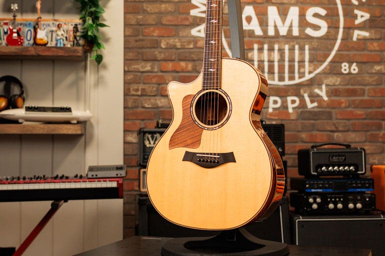 Photo of a left-handed acoustic guitar in the AMS studio