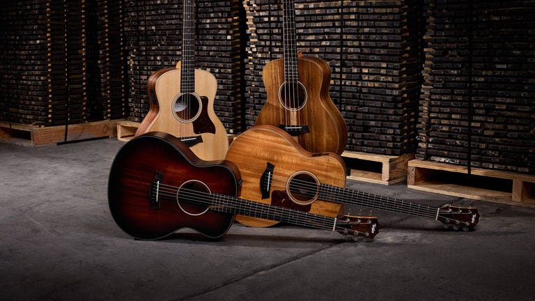 Photo of an assortment of travel-sized acoustic guitars