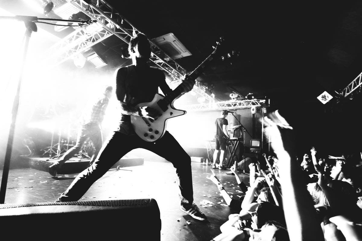 Guitar player performing for the first time