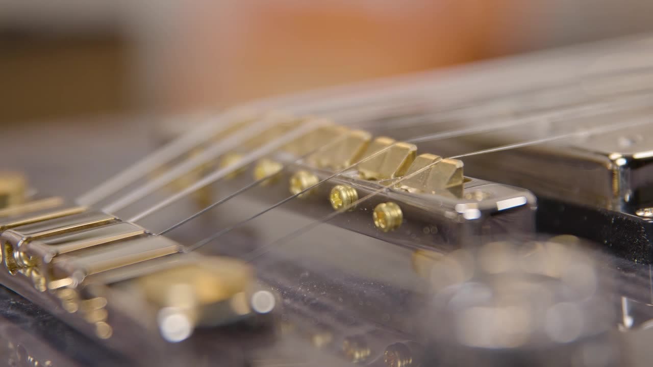 How to adjust intonation on a guitar bridge when first unboxing AMS