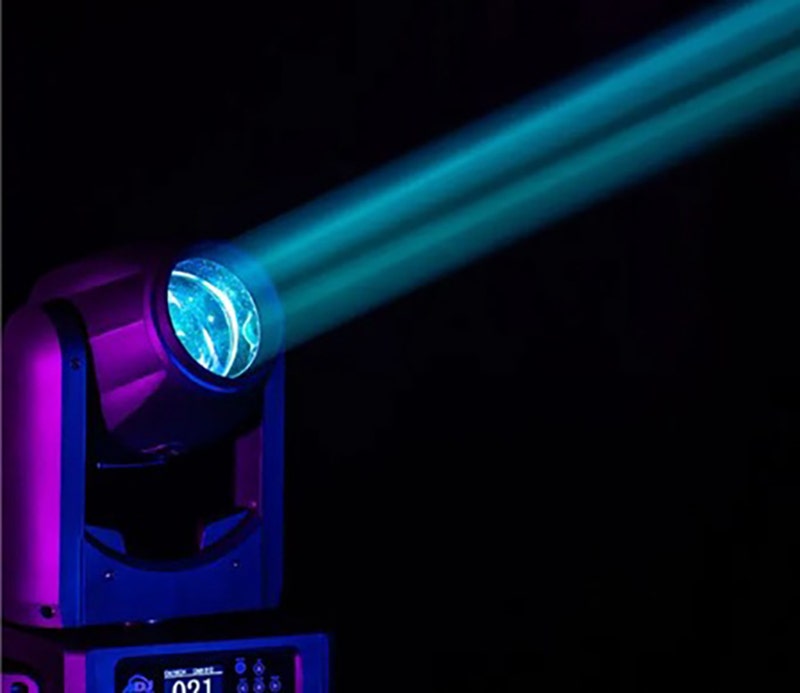 Stage spotlight projecting a bright blue beam of light against a dark background