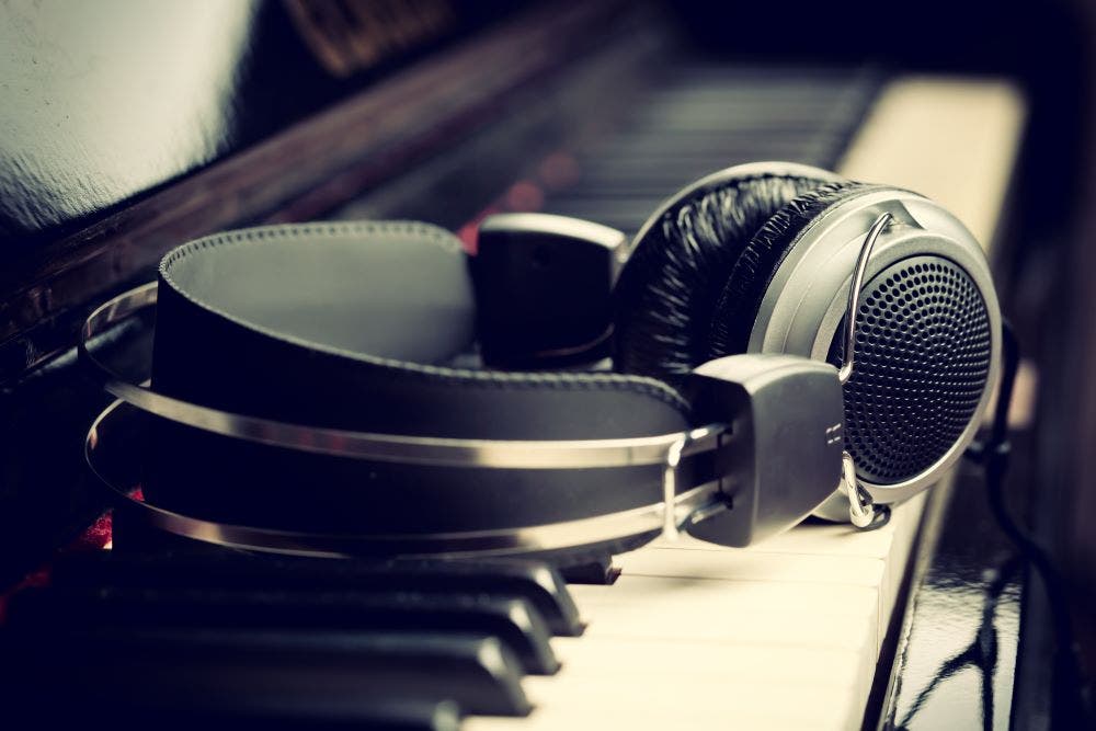 Open-back headphones on a piano