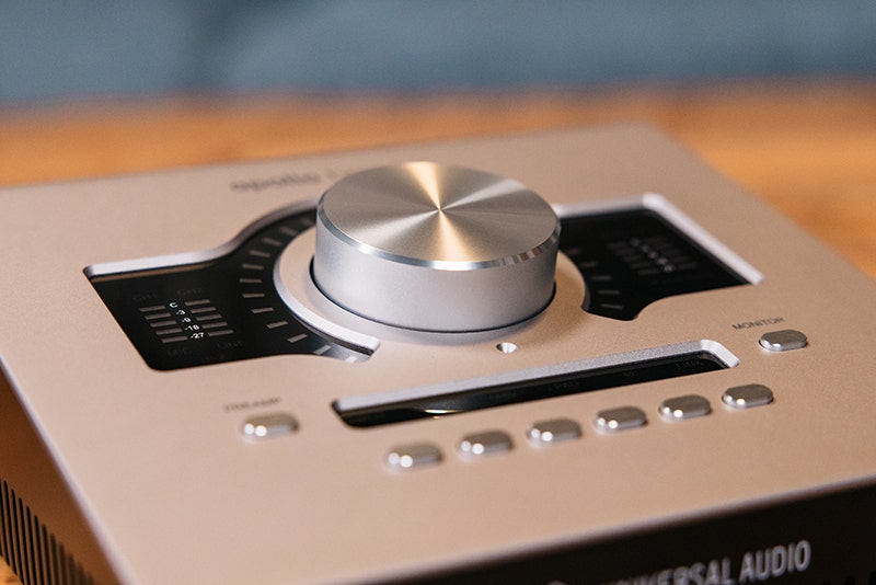 Recording mixer with tactile controls and display screen.