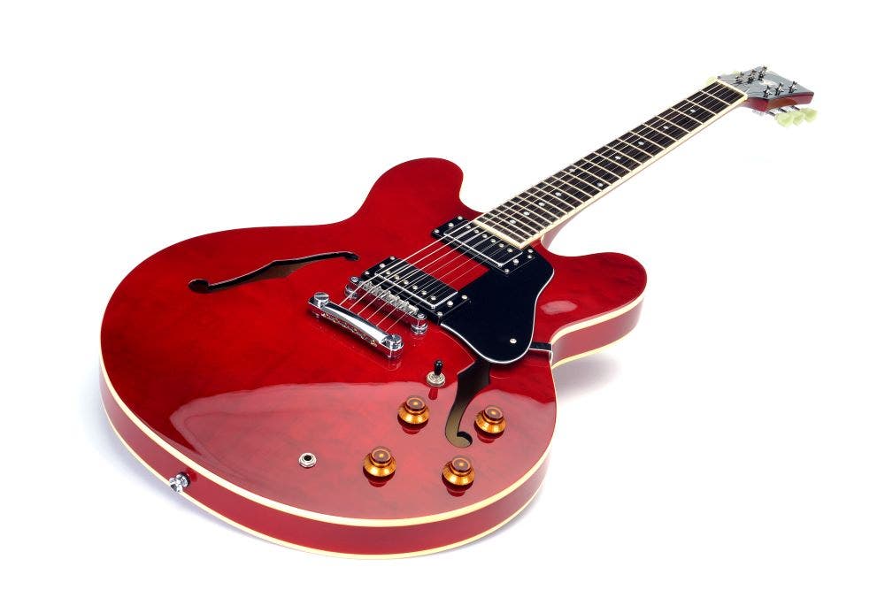 red semi-hollow electric guitar with white background - Gibson ES-335