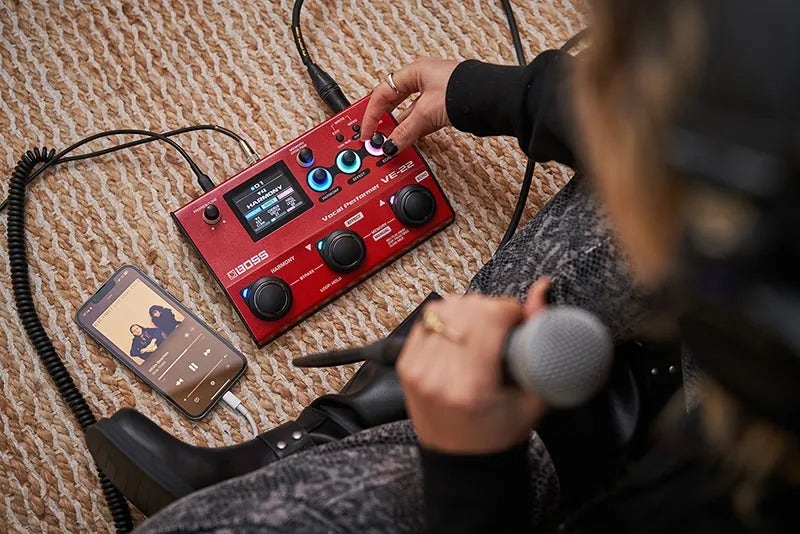 Signal processor with knobs and display for audio adjustments.