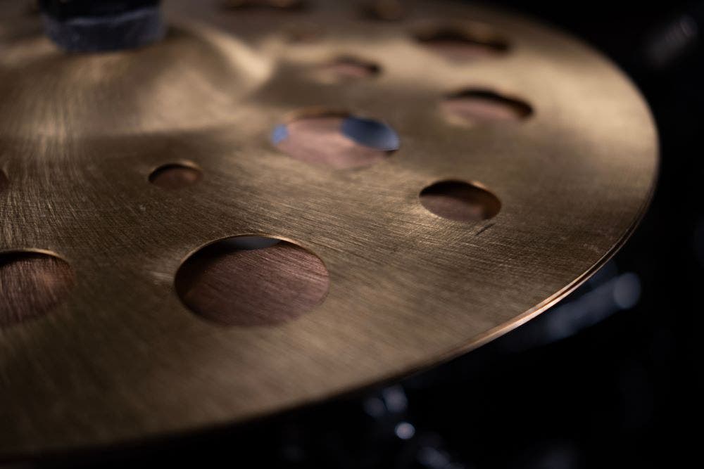 Specialty cymbal with holes