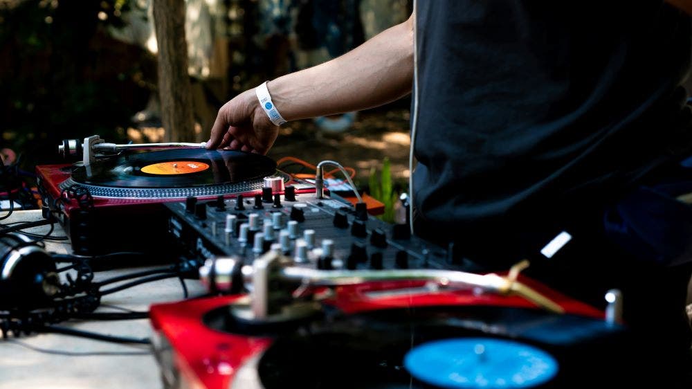 DJ playing vinyl turntables